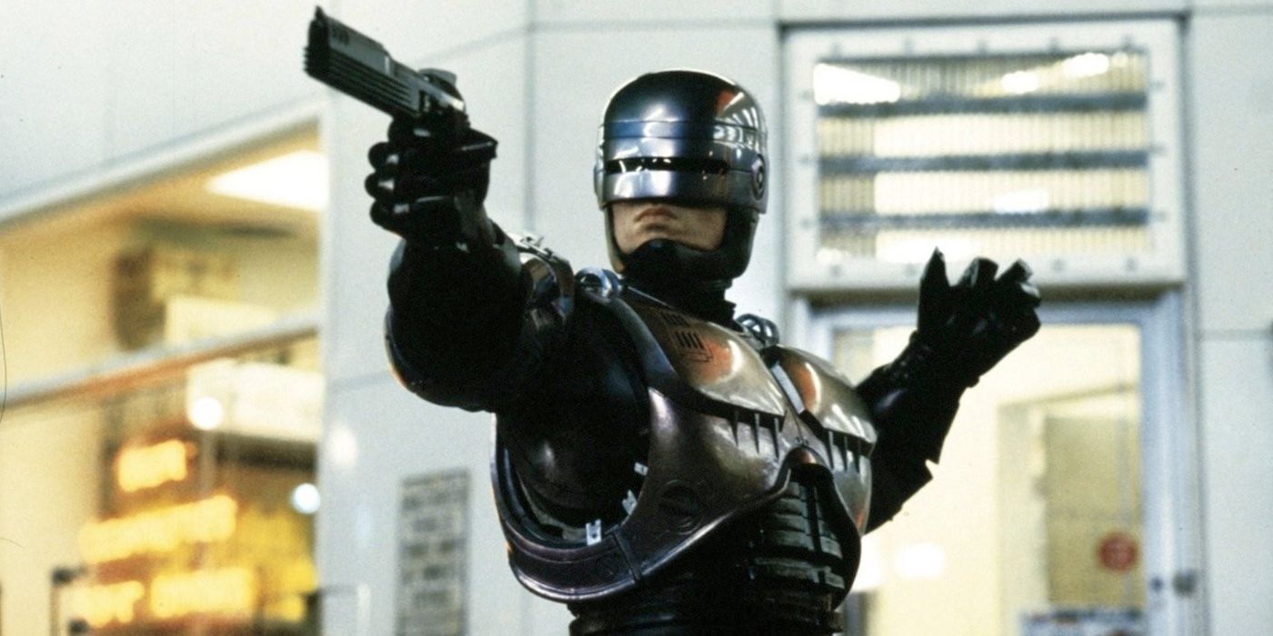 Peter Weller as RoboCop holding a gun