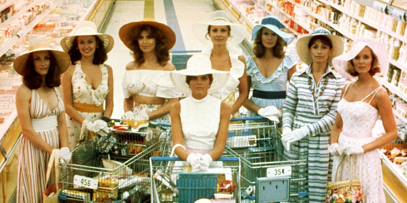 Women standing with shopping carts against the backdrop of a superstore in a still from The Stepford Wives