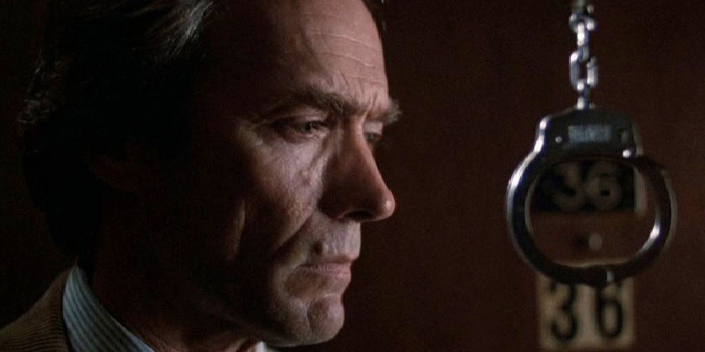 Clint Eastwood stands by a dangling handcuff in Tightrope