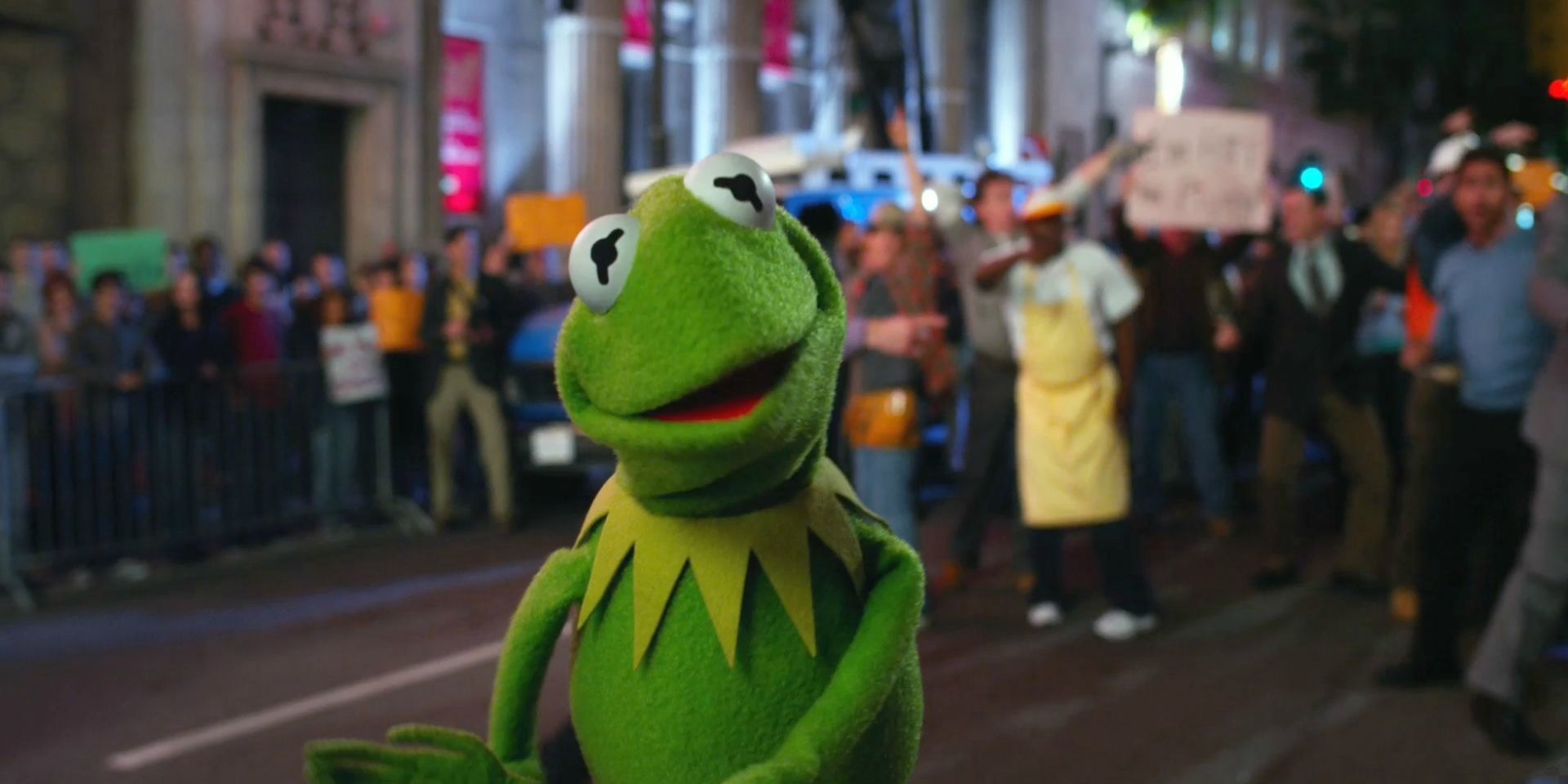 Kermit the Frog in front of crowd in 2011's The Muppets