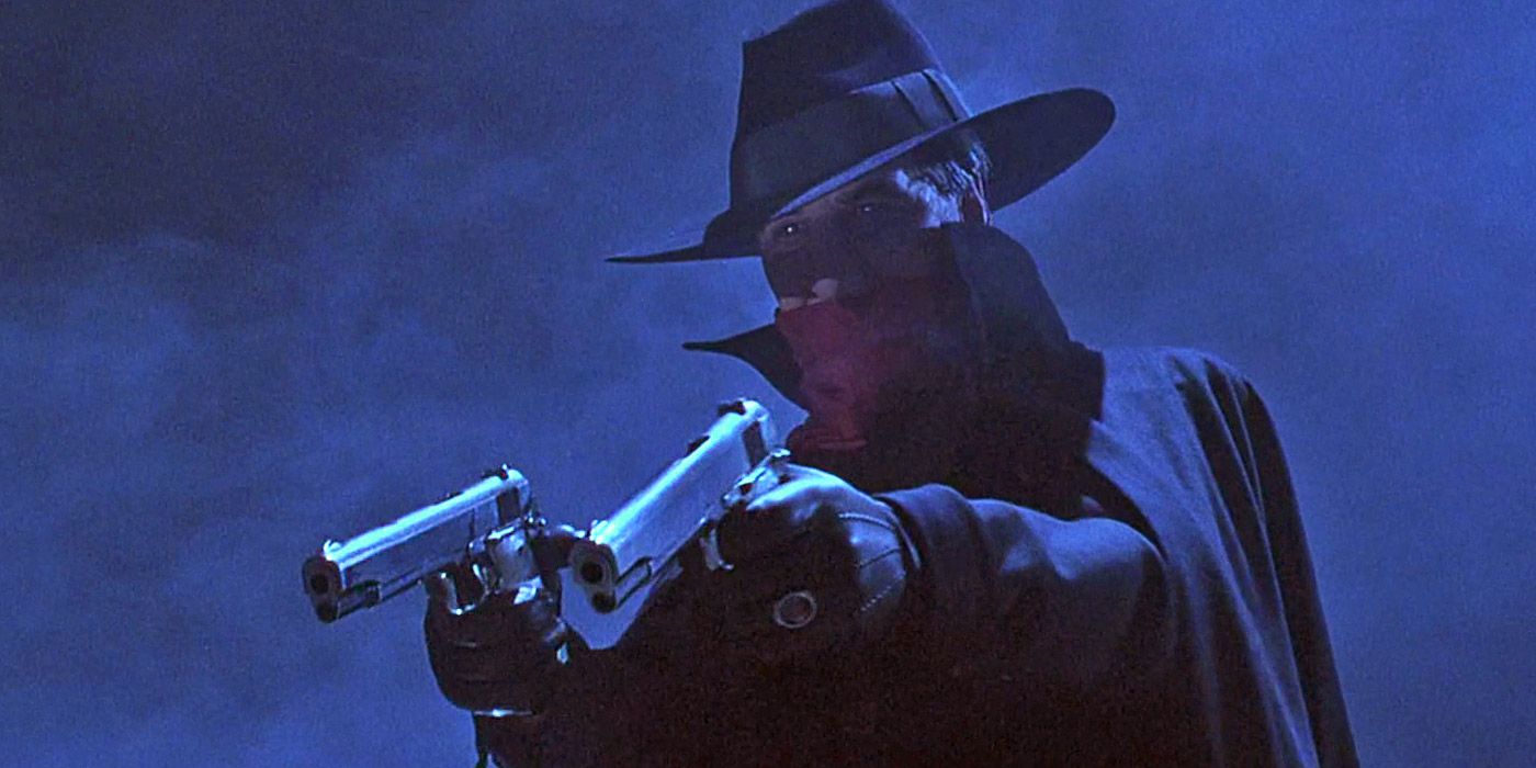 The Shadow pointing a gun in the titular film
