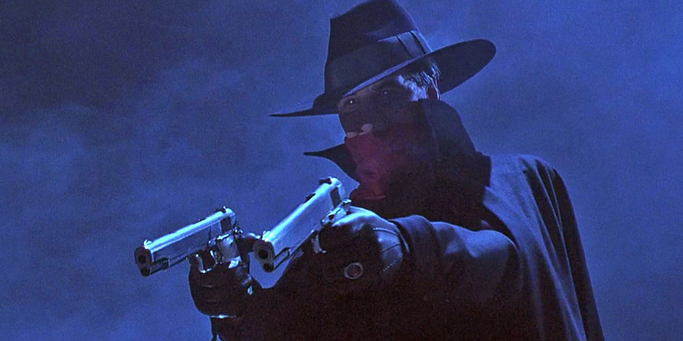 The Shadow pointing a gun in the titular movie