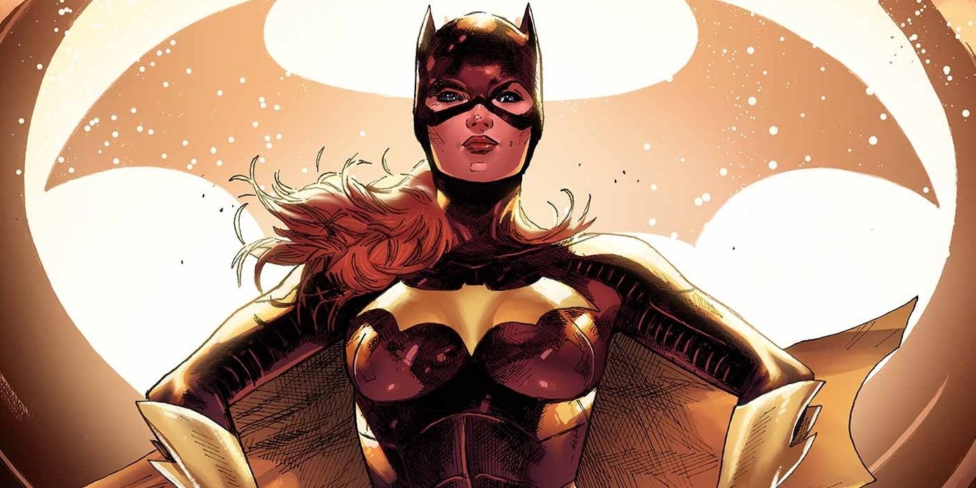 Batgirl standing in front of the Batsignal in DC comics