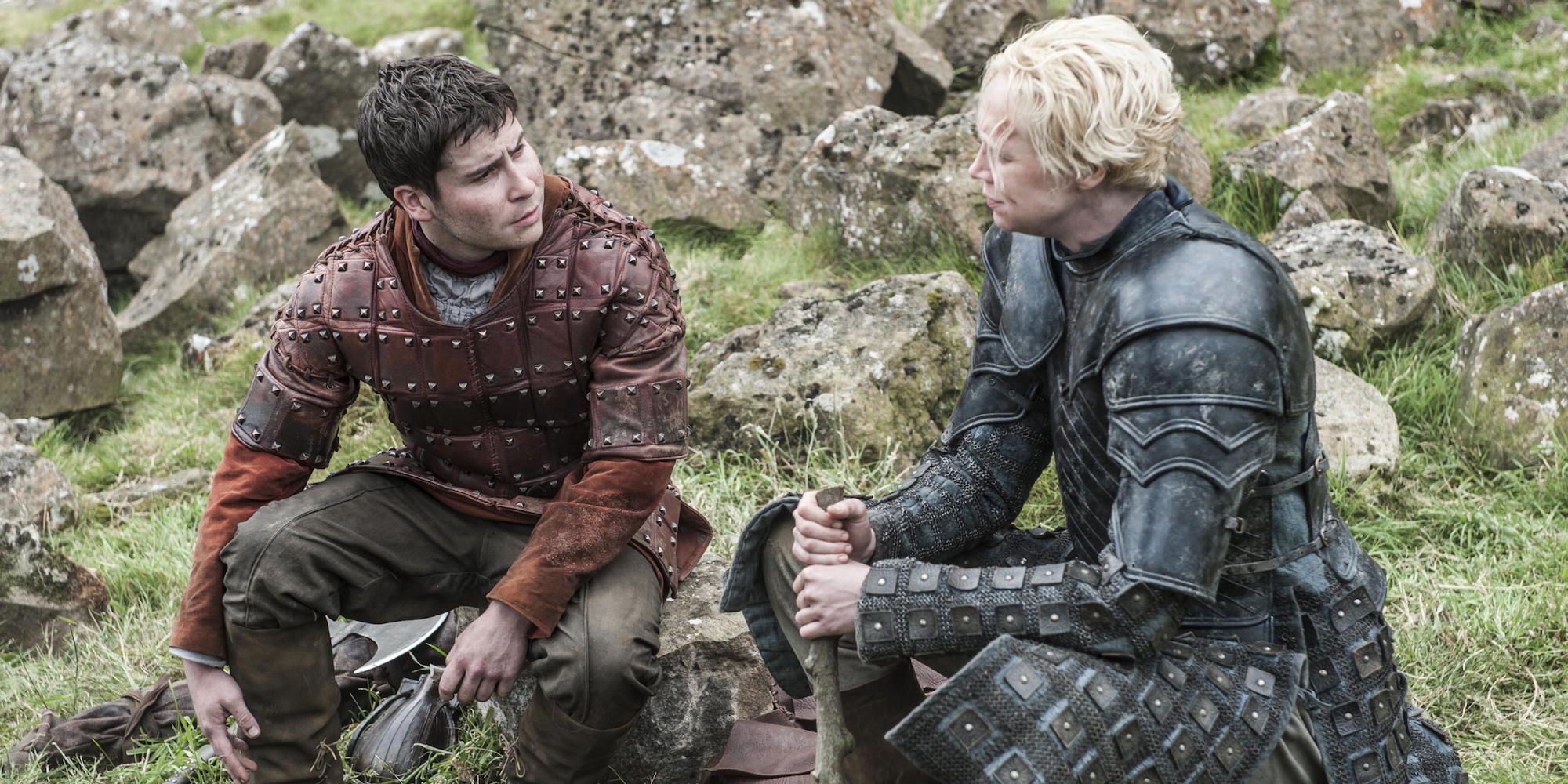 Brienne and Podrick talking in an open field in Game of Thrones.
