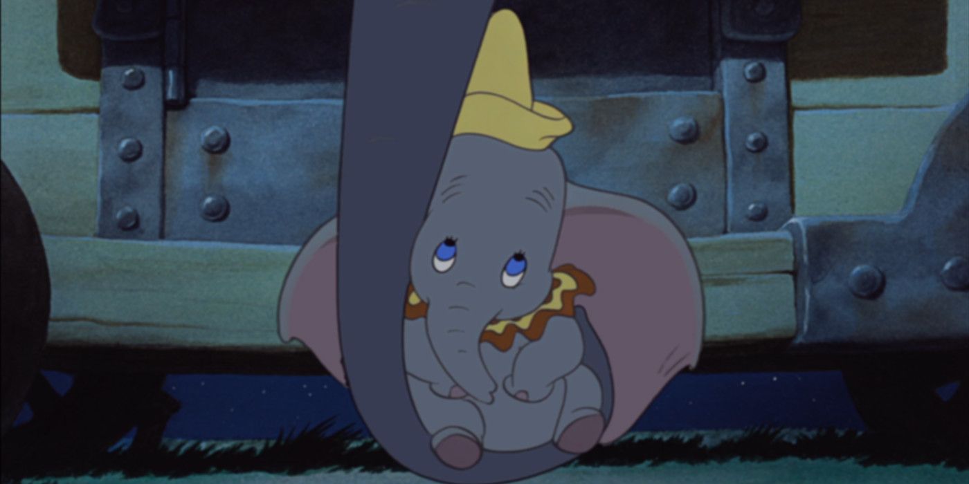 A still of Dumbo hugging his mom's trunk in Disney