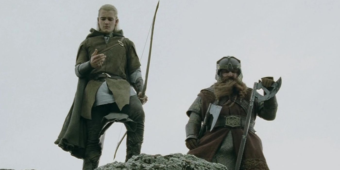 Gimli dan Legolas berdiri bersama di puncak singkapan berbatu di Lord of the Rings. 
