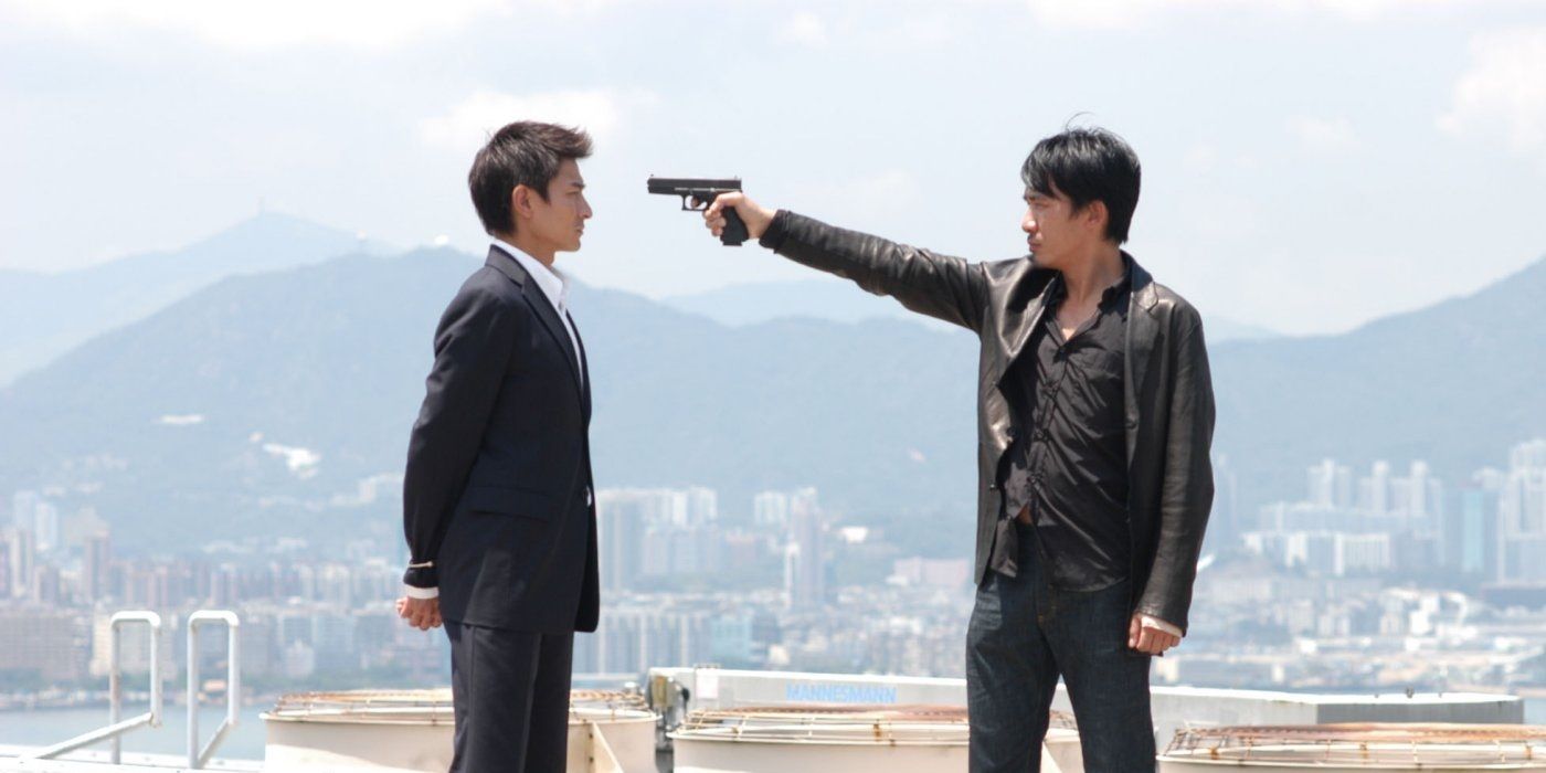 A man holding another man at gunpoint in Infernal Affairs