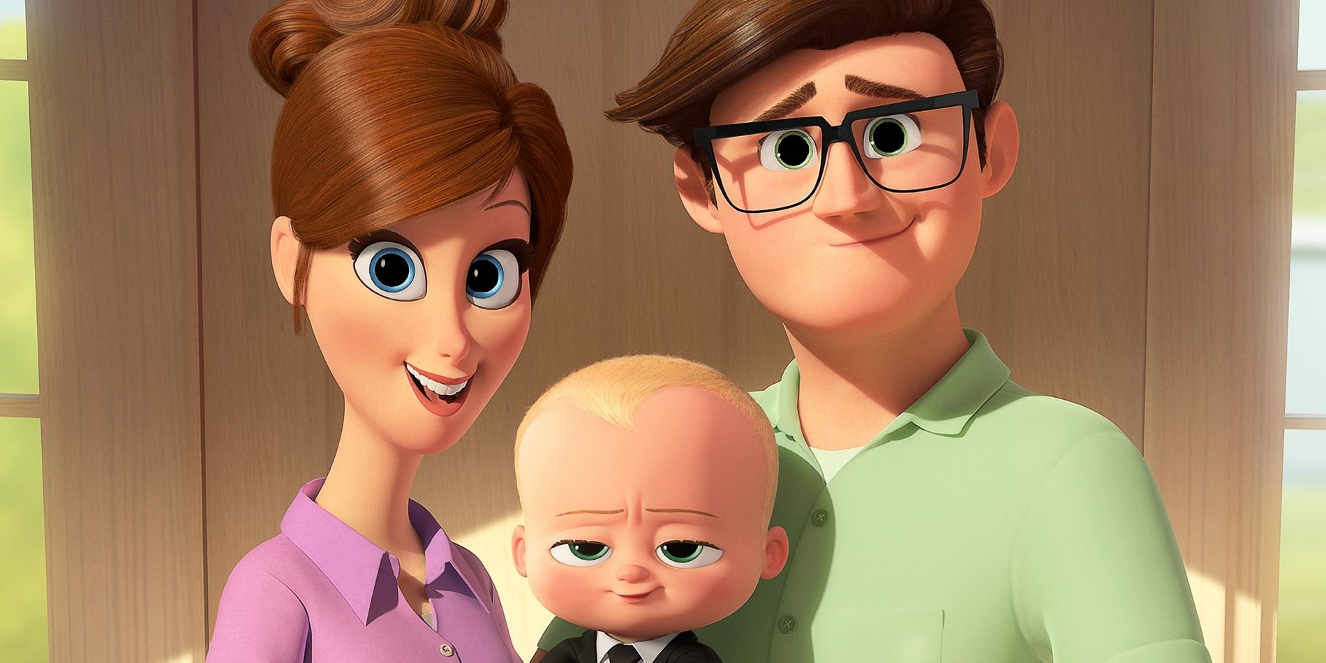 Two parents smiling with a baby in The Boss Baby