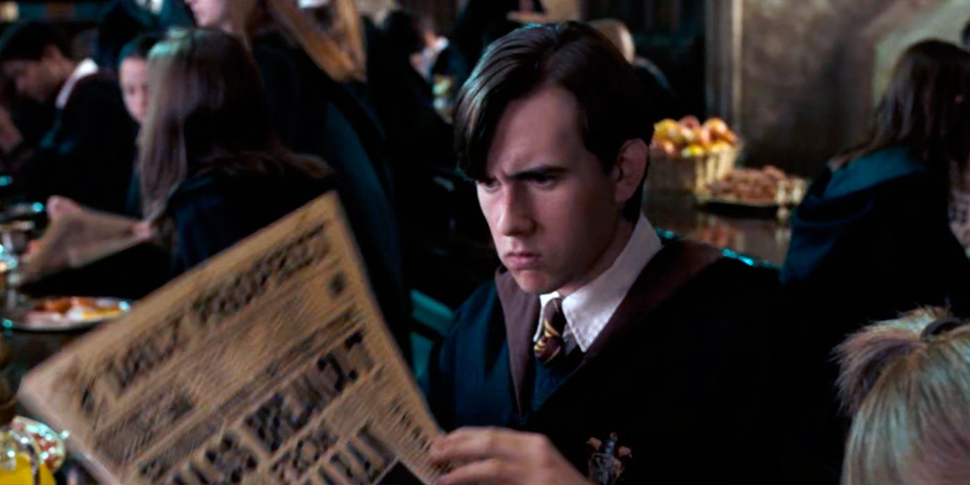 Neville reads a newspaper in Harry Potter