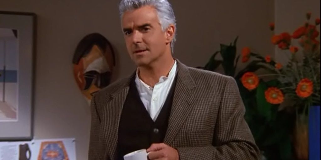 Peterman holding a cup of coffee on Seinfeld