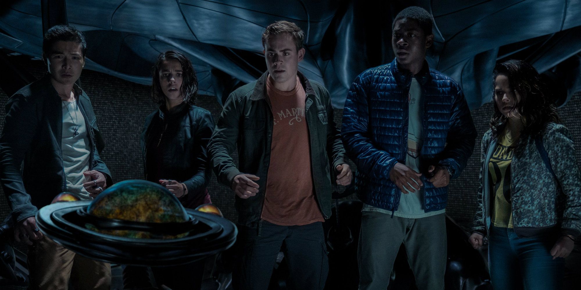 The Power Rangers in a cave in Power Rangers