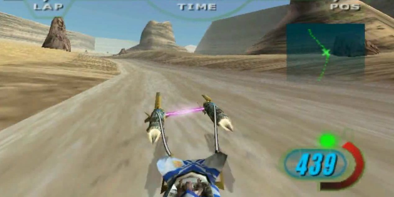 A screenshot of Star Wars Episode 1: Racer for N64, showing Anakin's podracer speeding through the Tatooine desert at a 439 speed rate.