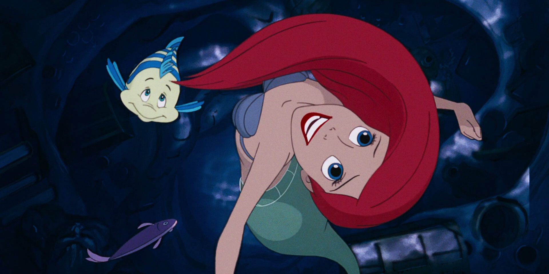 Flounder swimming behind Ariel in the grotto when she sings "Part of Your World" in the animated The Little Mermaid