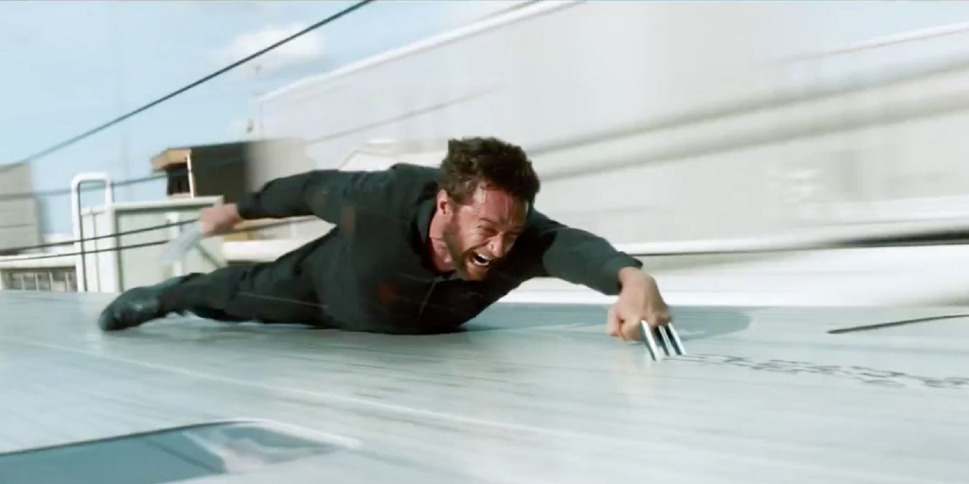 Wolverine tries to hold on to a bullet train in The Wolverine