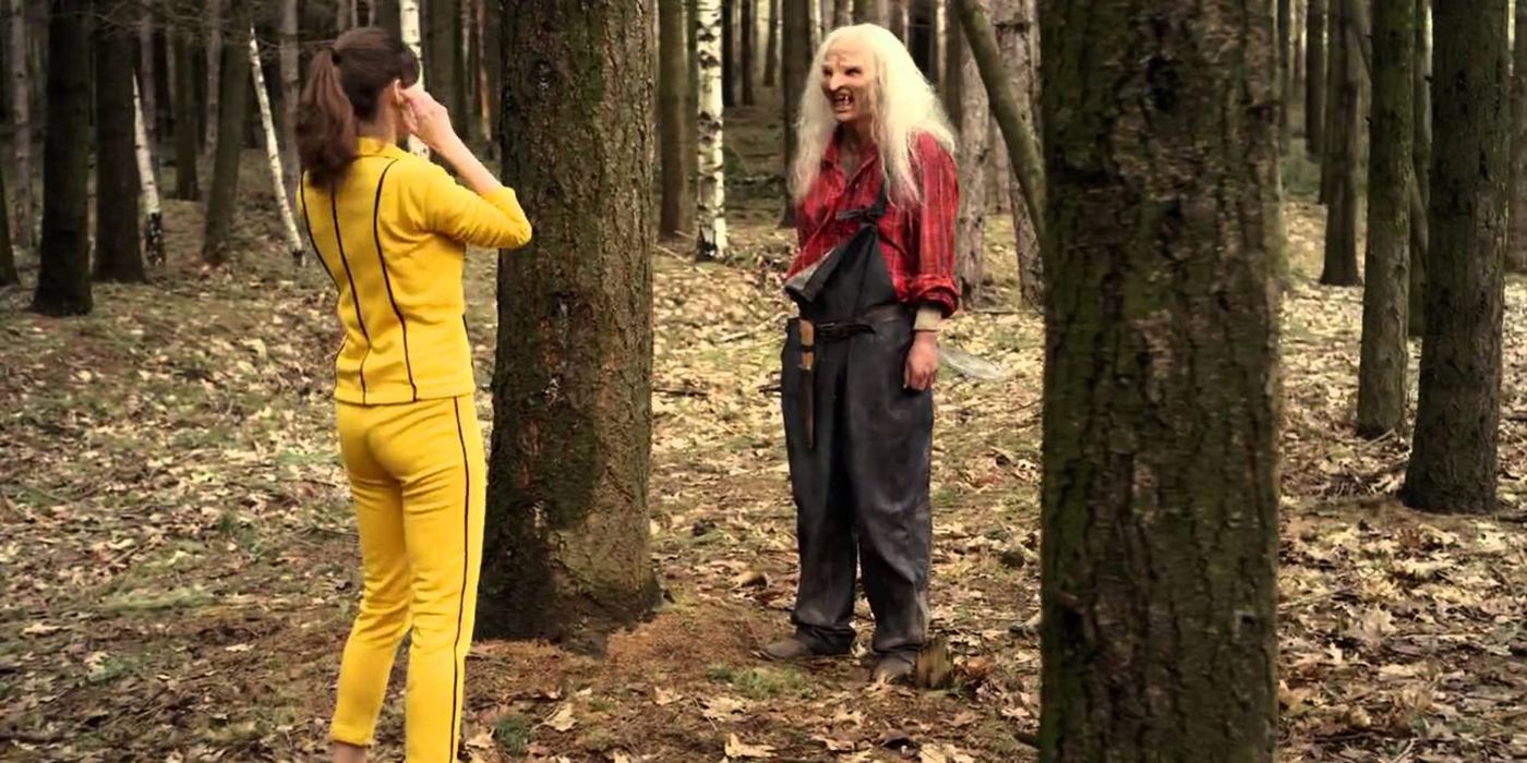 Kaleen Webber and Three Finger facing each other in the woods in Wrong Turn 5