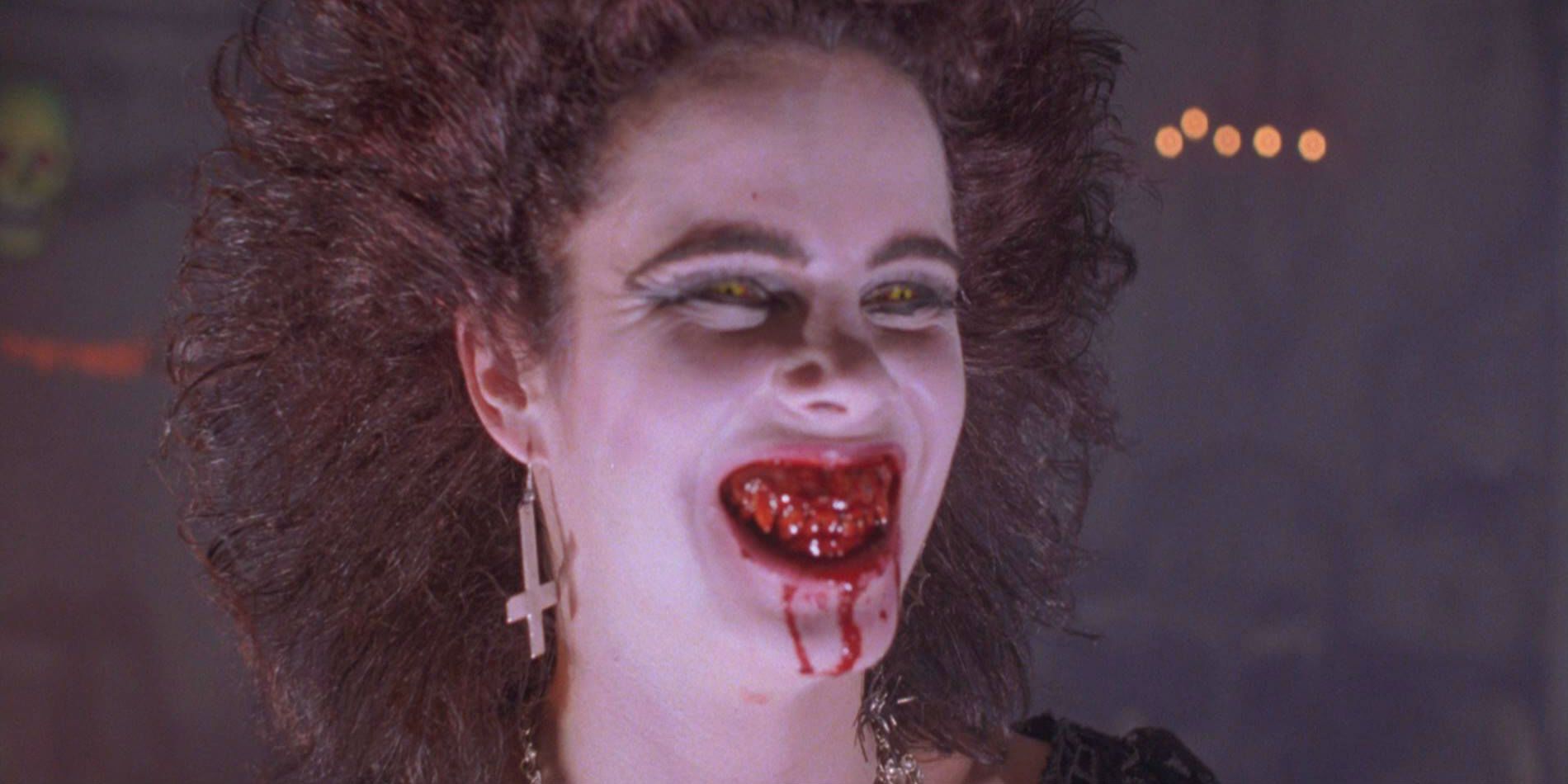Angela laughs with bloody teeth from Night of the Demons 