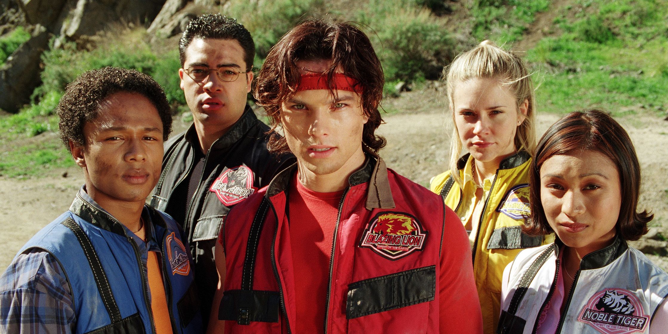 The Power Rangers Wild Force team stares at the camera out of uniform