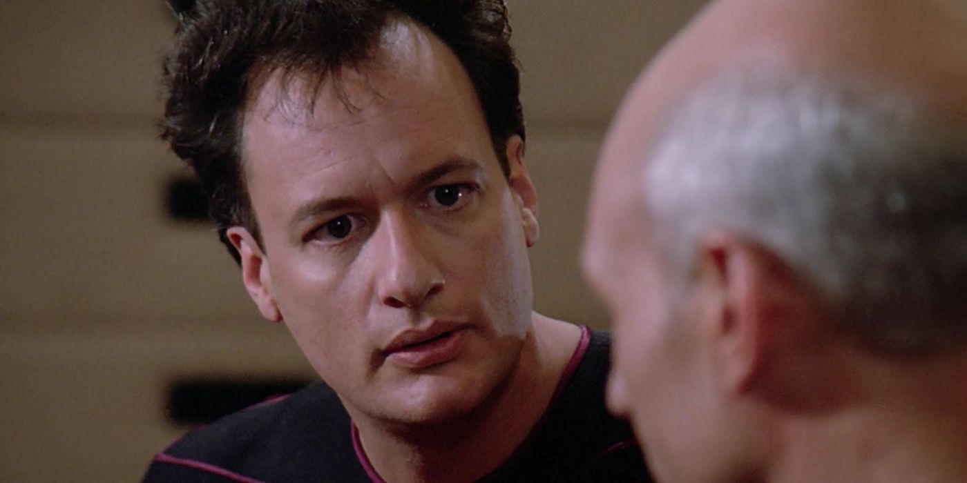 Q talks animatedly to Picard in Star Trek TNG