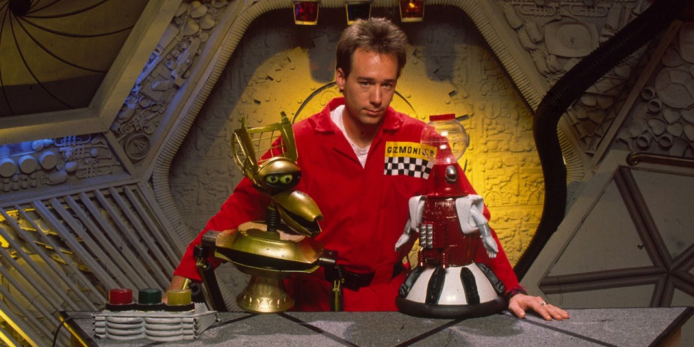 Joel looks on with Tom Servo and Crow T. Robot from Mystery Science Theater 3000