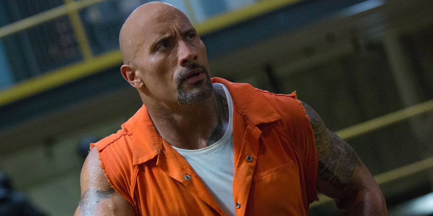 Dwayne Johnson as Hobbs in Fate of the Furious wearing a sleeveless prison uniform