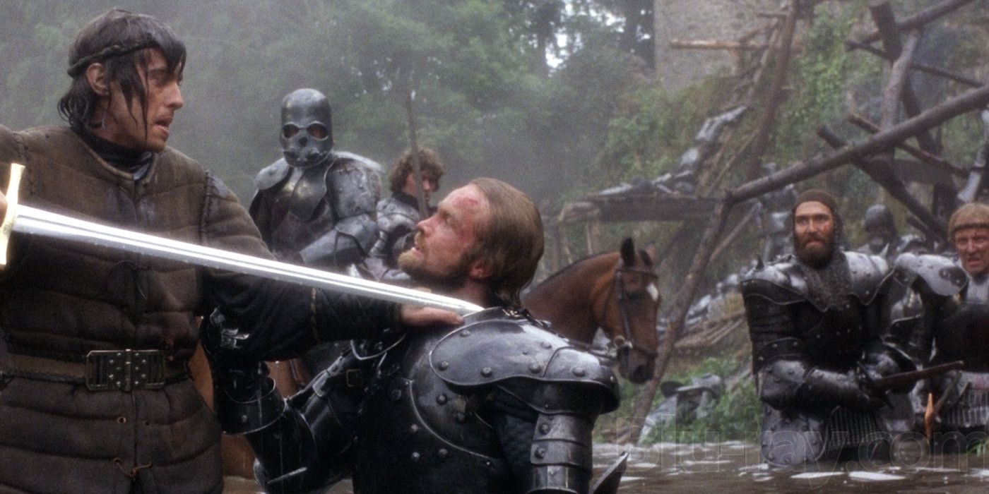 An image of a person holding a sword to his enemy's throat in the Excalibur movie