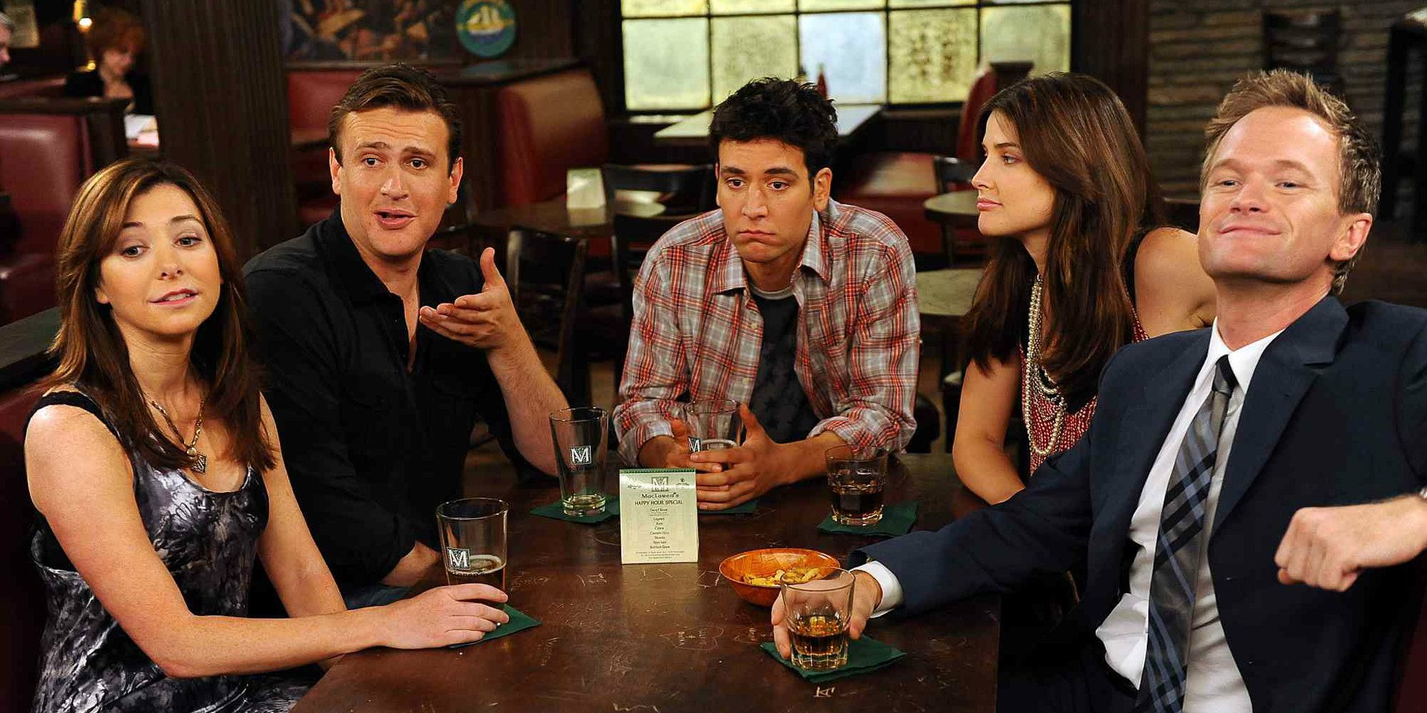 The friends from How I Met Your Mother sitting in McLaren's, all looking at something.