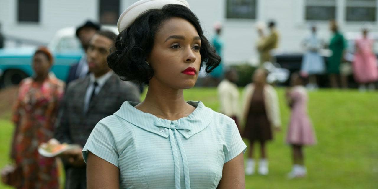 Mary stands in front of a crowd at a picnic in Hidden Figures
