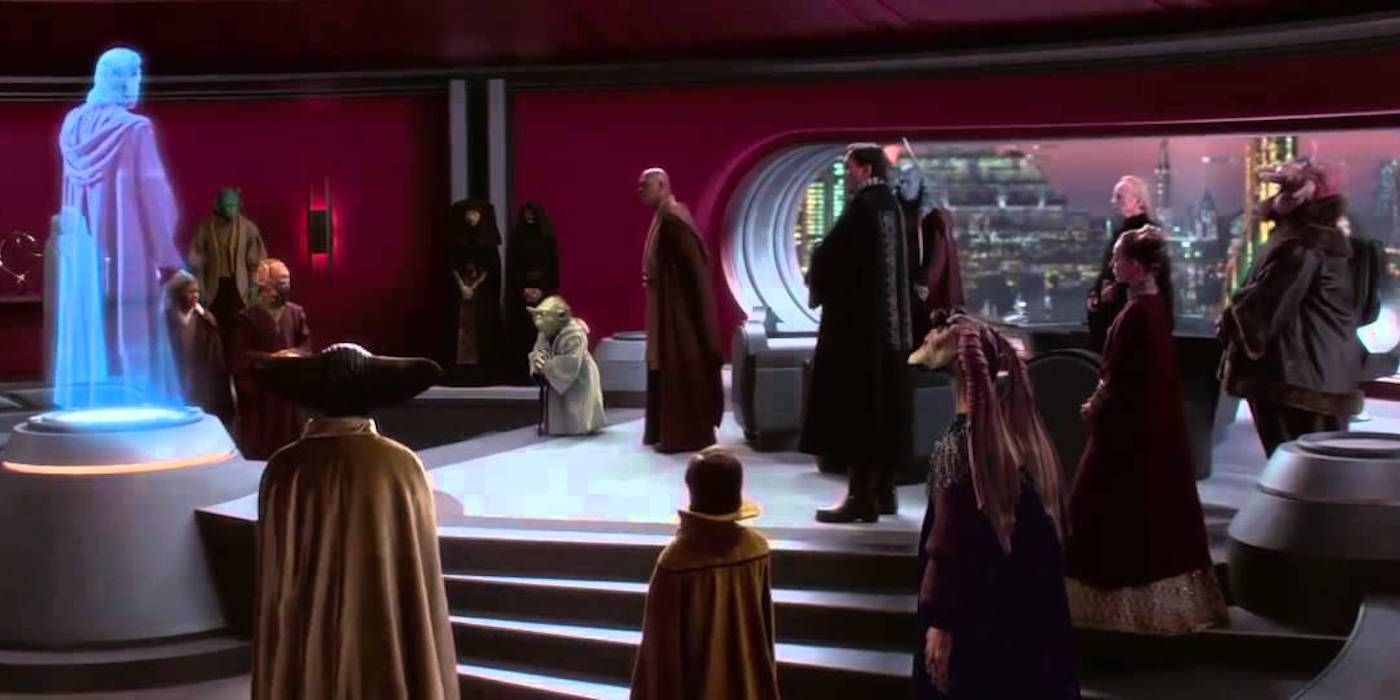 Jar Jar, Palpatine, and the Jedi stand in Palpatine's office with Obi-Wan as a hologram in Attack of the Clones.