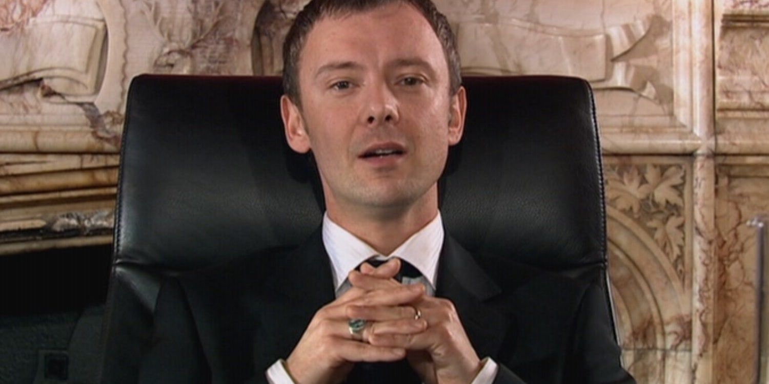 John Simm sitting in the chair as The Master in Doctor Who