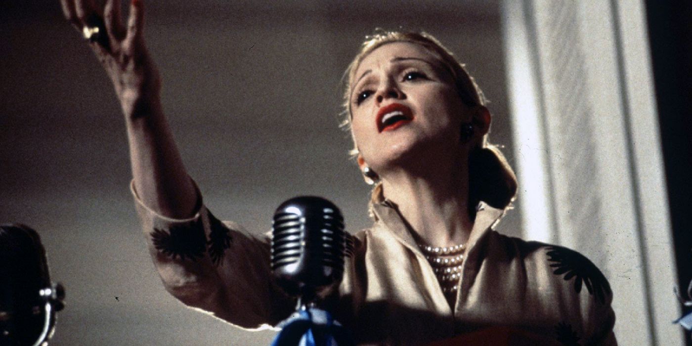Madonna singing into a microphone in Evita