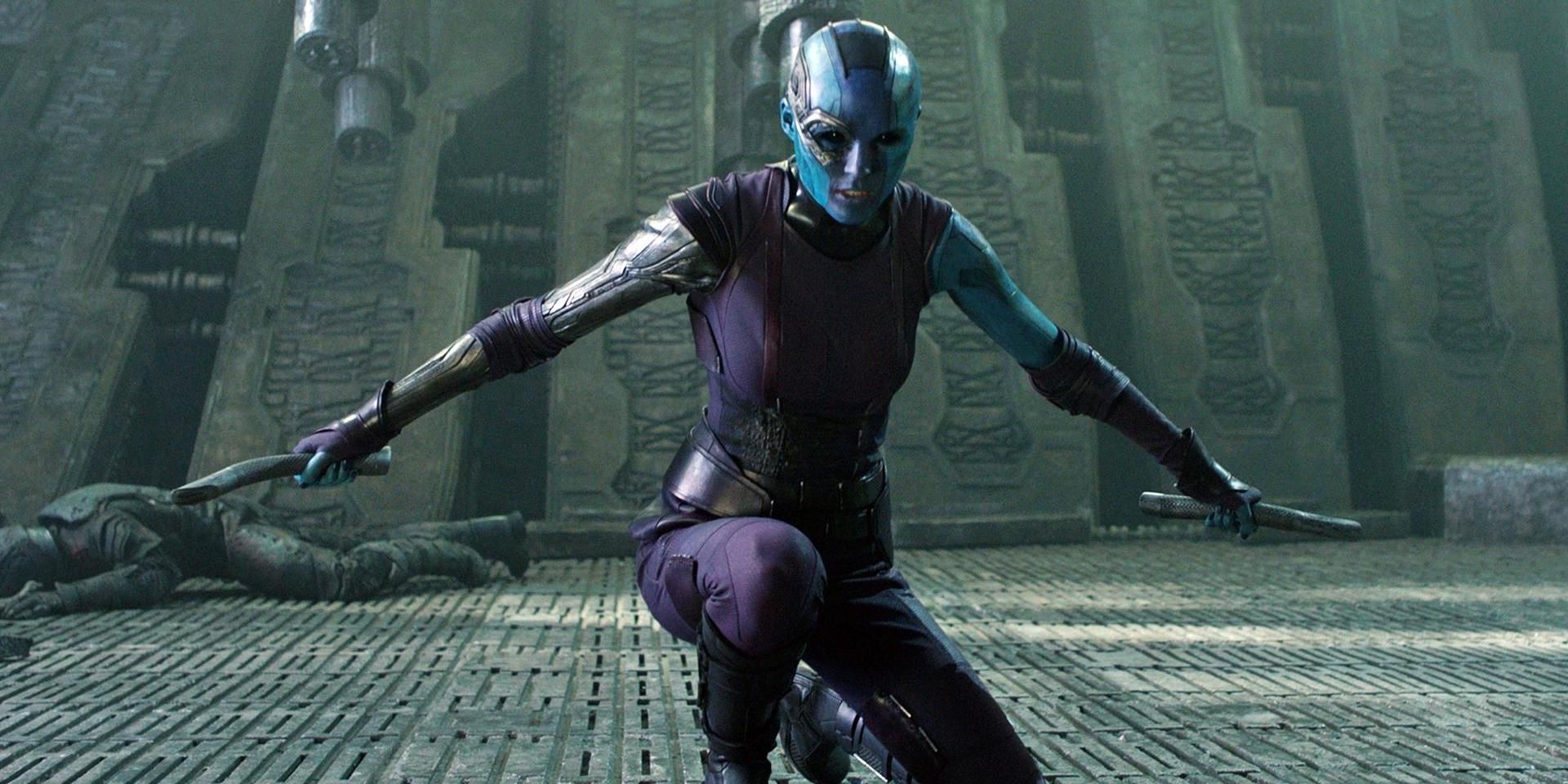 Nebula kneels, brandishing her weapons, in Guardians of the Galaxy