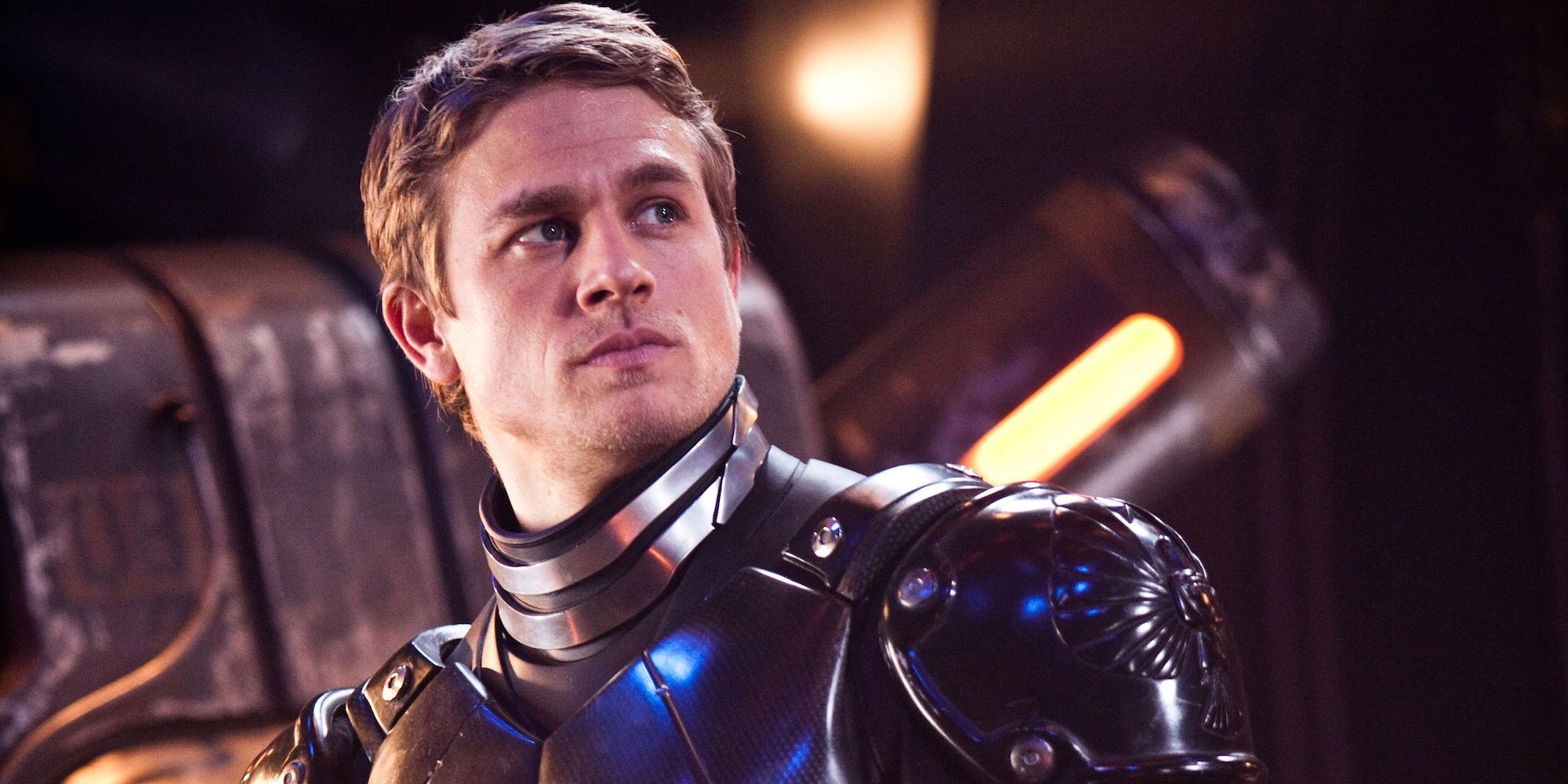 Raleigh looking up while wearing a battle suit in Pacific Rim.