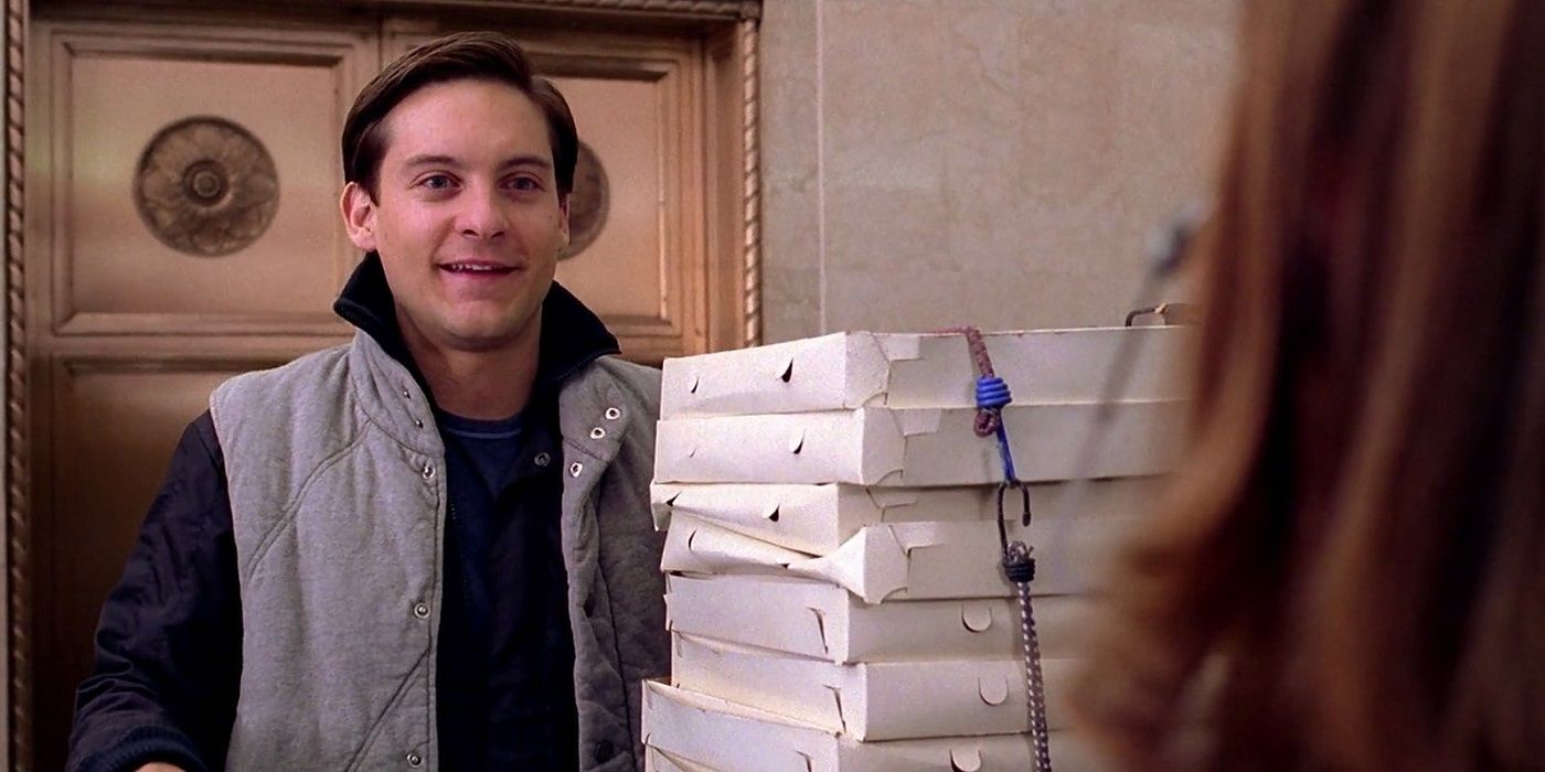 Peter Parker holding a large tower of pizzas in Spider-Man 2.