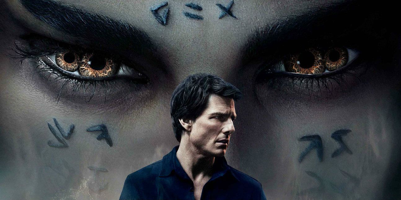 Tom Cruise character stands while The Mummy looms behind him