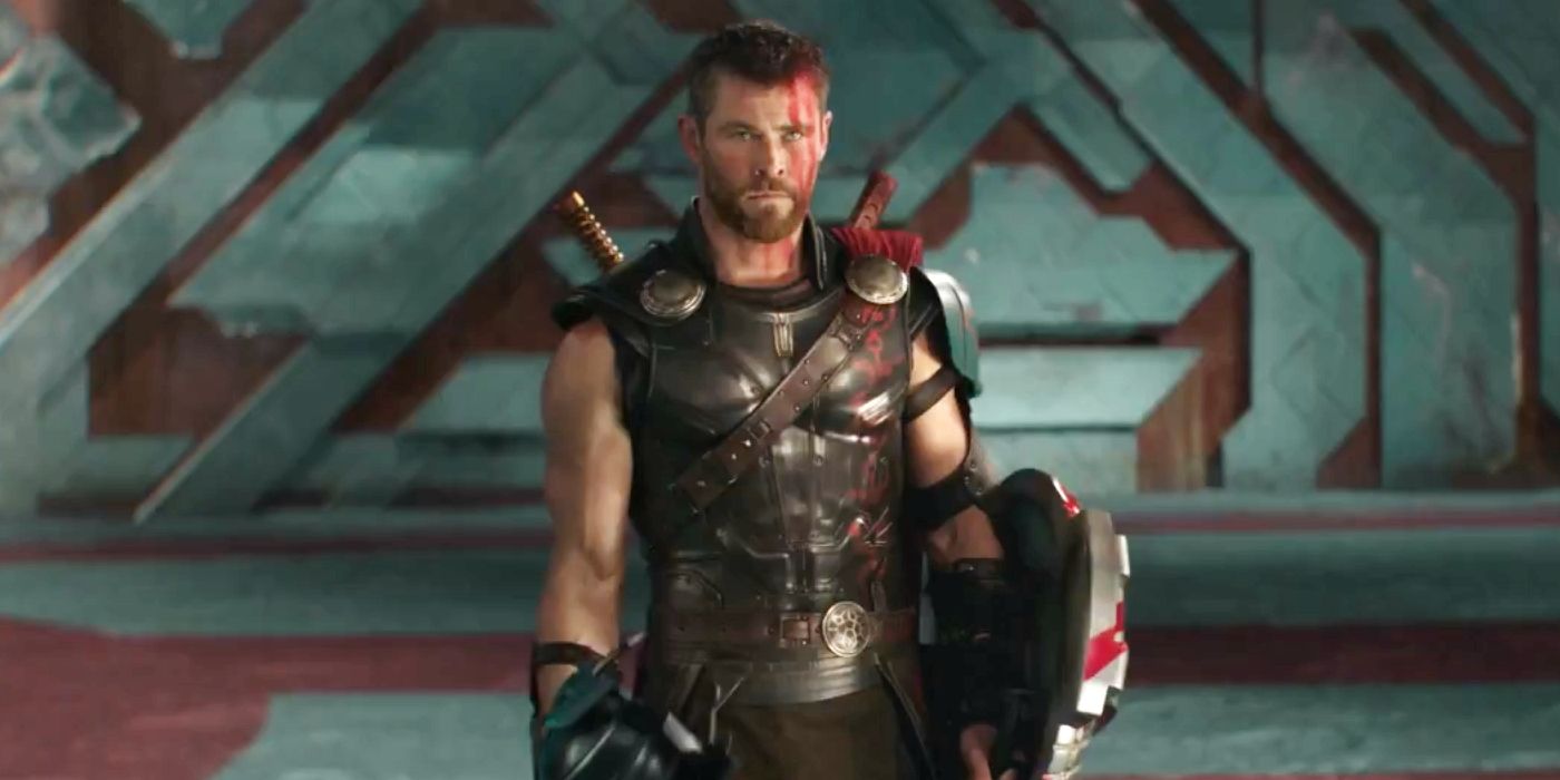 Thor stands in his armor with a shield in the arena in Thor: Ragnarok