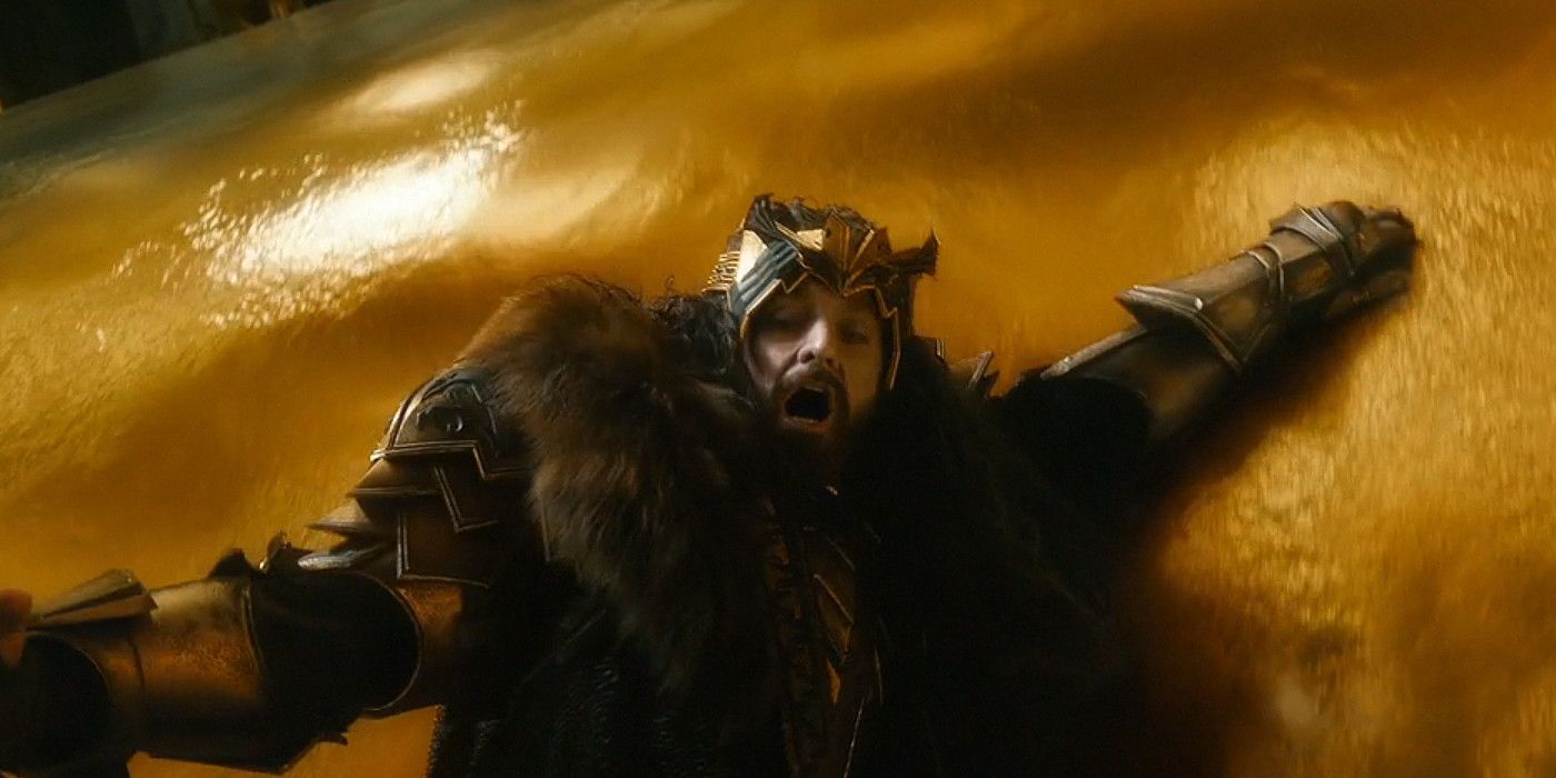 Thorin Oakenshield sliding down a statue in Smaug's hoard in The Hobbit