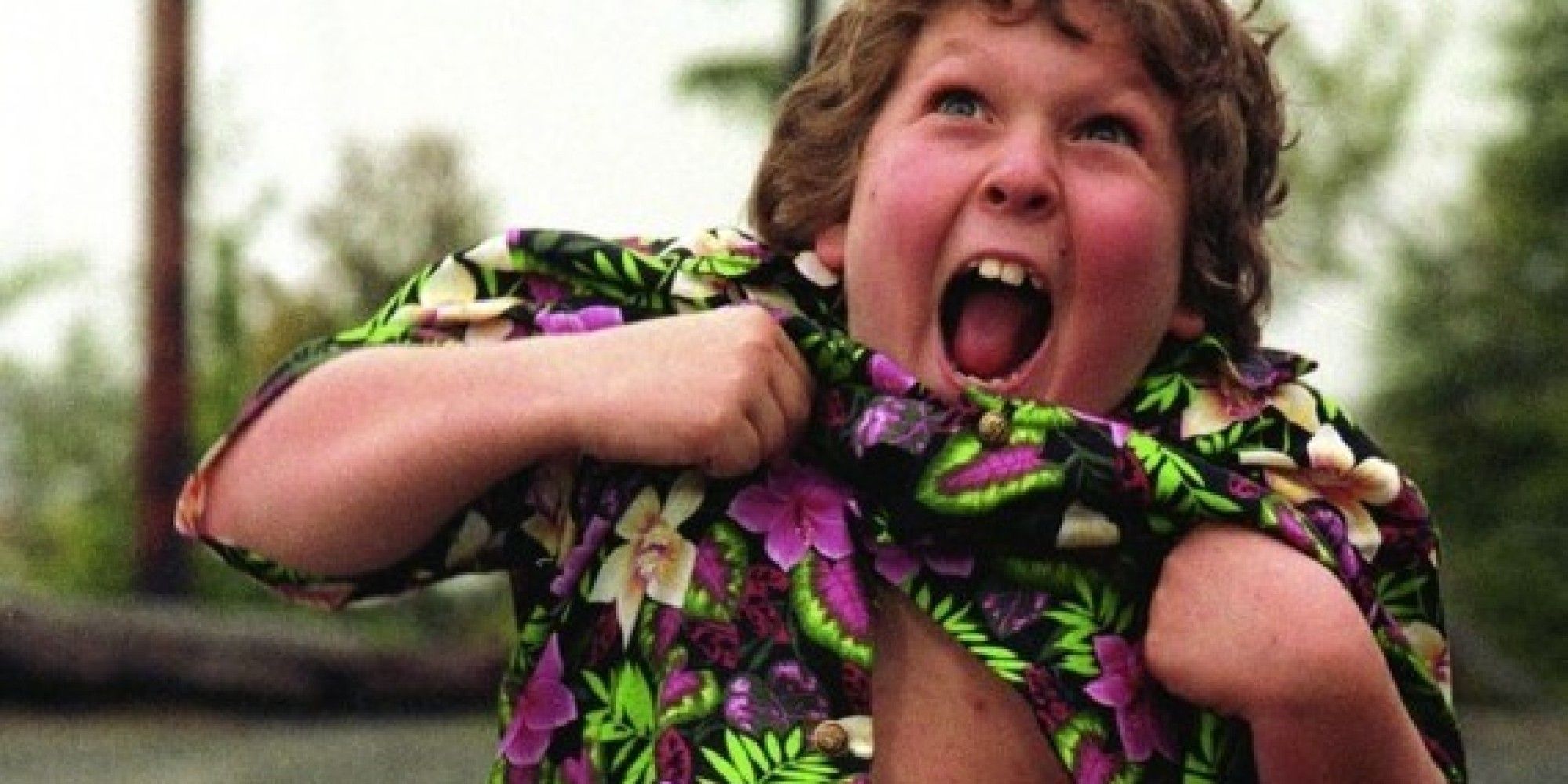 Jeff Cohen as Chunk lifting his shirt up in The Goonies