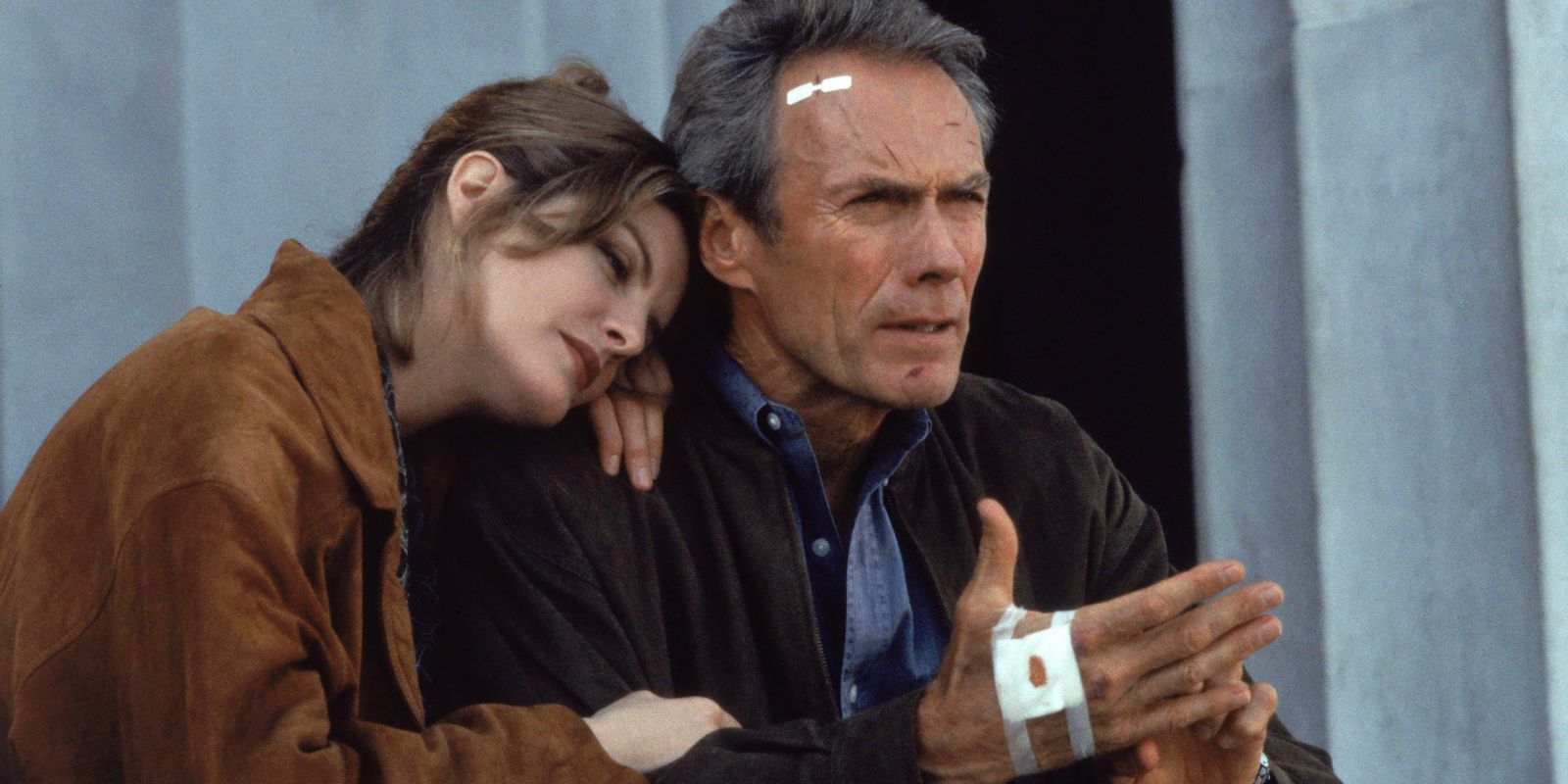 Lily resting her head on Frank's shoulder in In The Line Of Fire.
