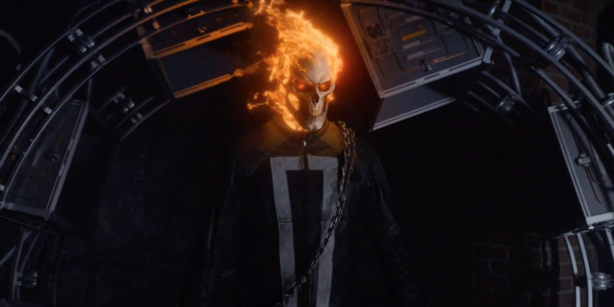 Robbie Reyes becomes the Ghost Rider in front of the dimensional gateway.