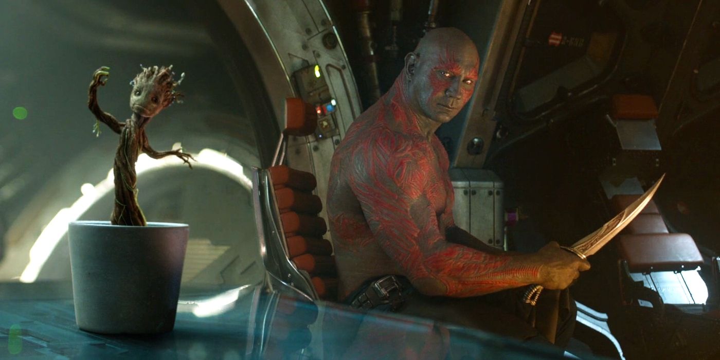 Drax Sharpening His Knives Aboard The Milano While Staring At Frozen Baby Groot Dancing From Guardians of the Galaxy