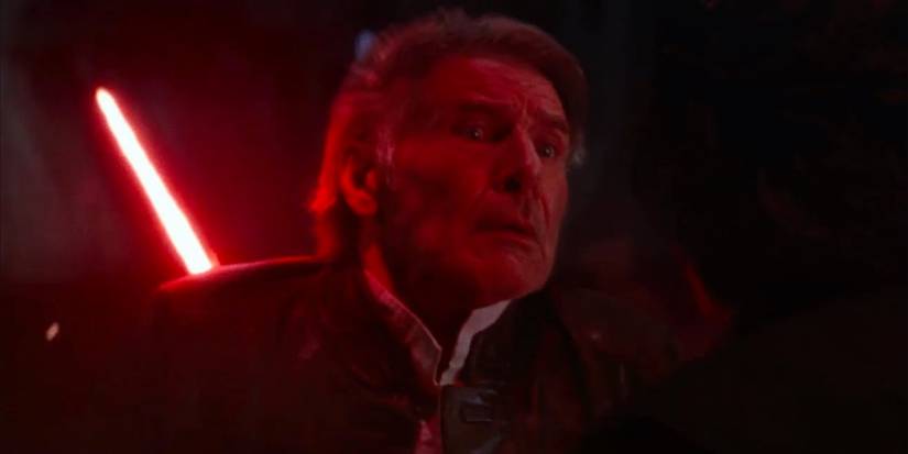 Han Solo death in Star Wars 7 The Force Awakens with Han looking surprised and pained