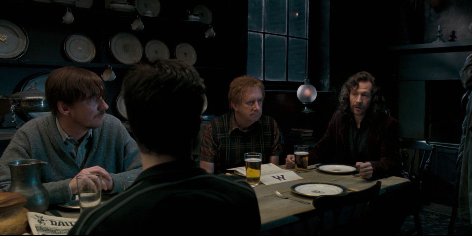 Harry Potter ORder of the PHoenix sits at kitchen table at 12 grimmauld place