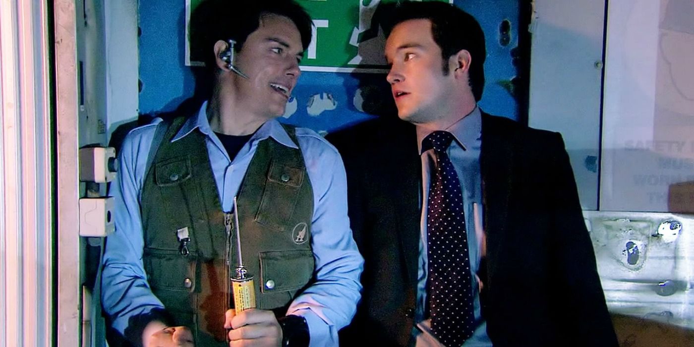 Boyfriends Jack Harkness (John Barrowman) and Ianto Jones (Gareth David-Lloyd) look at each other in Torchwood.