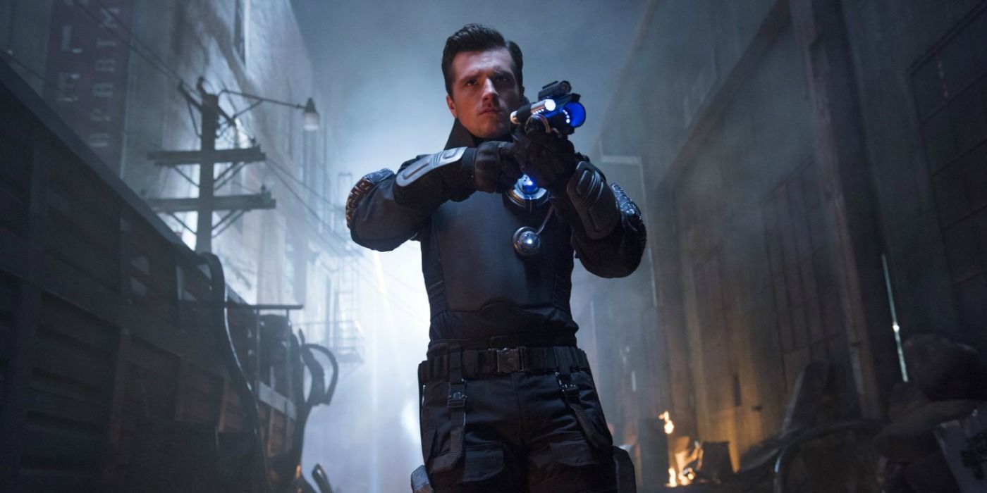 Josh Hutcherson holding a gun in Future Man on Hulu