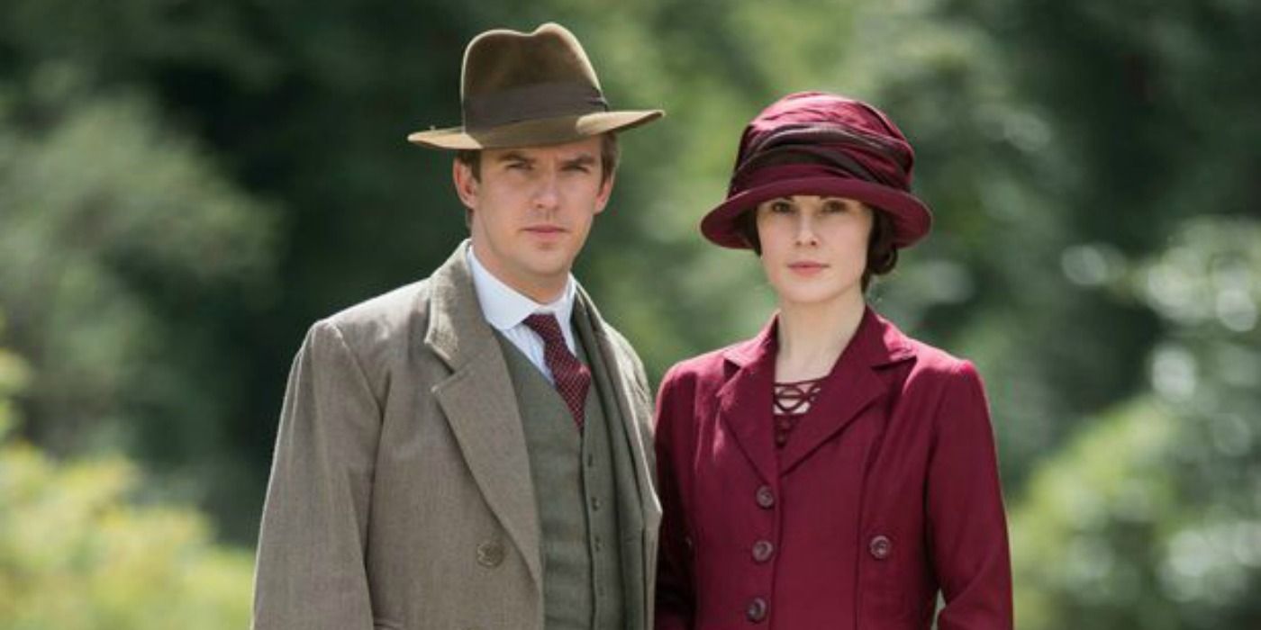 Lady Mary and Matthew Crawley snuggle up and stare at the camera at Downton Abbey