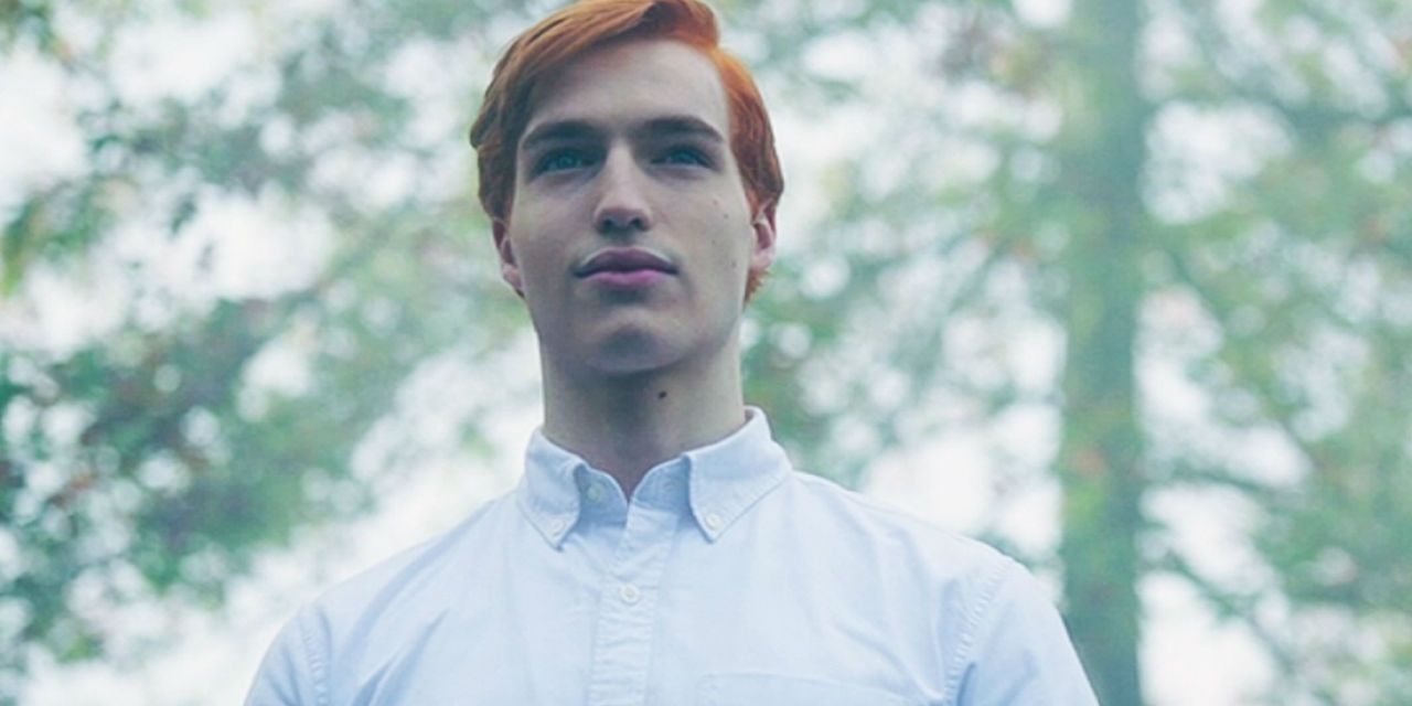 An image of Jason Blossom smiling in Riverdale