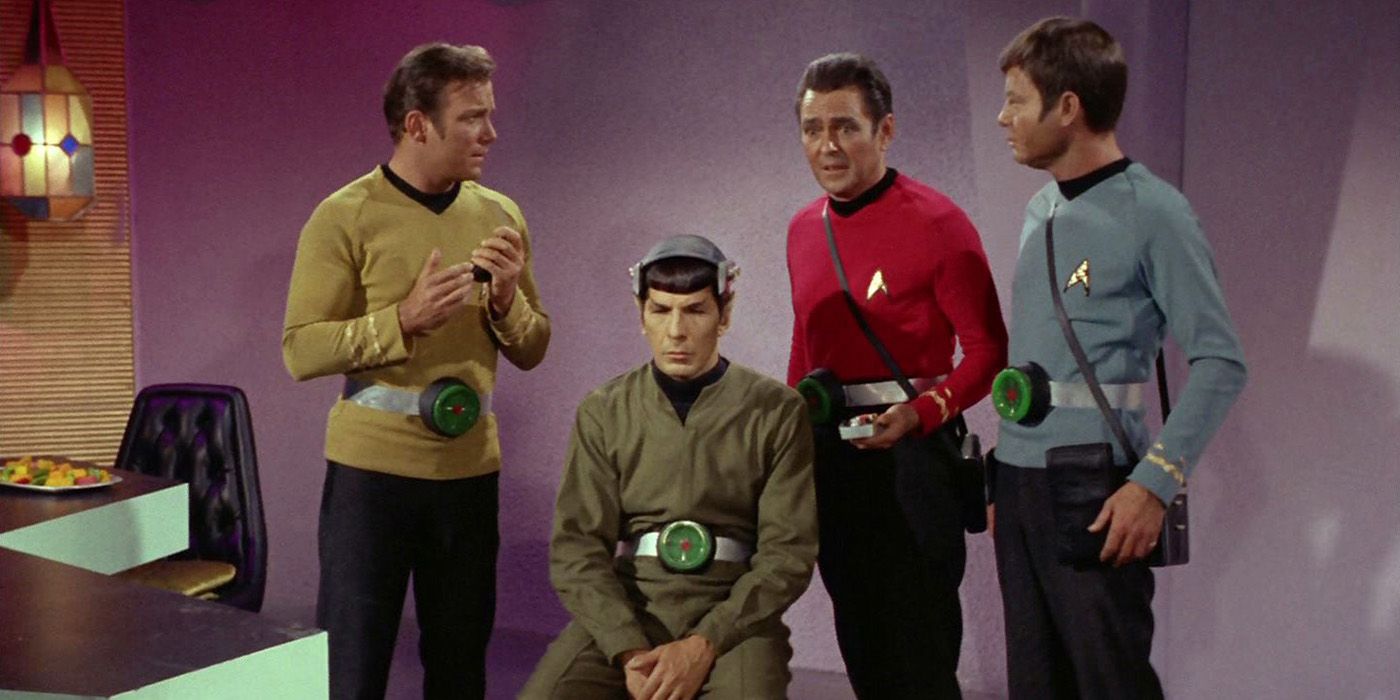 The crew gathers around Spock from Star Trek