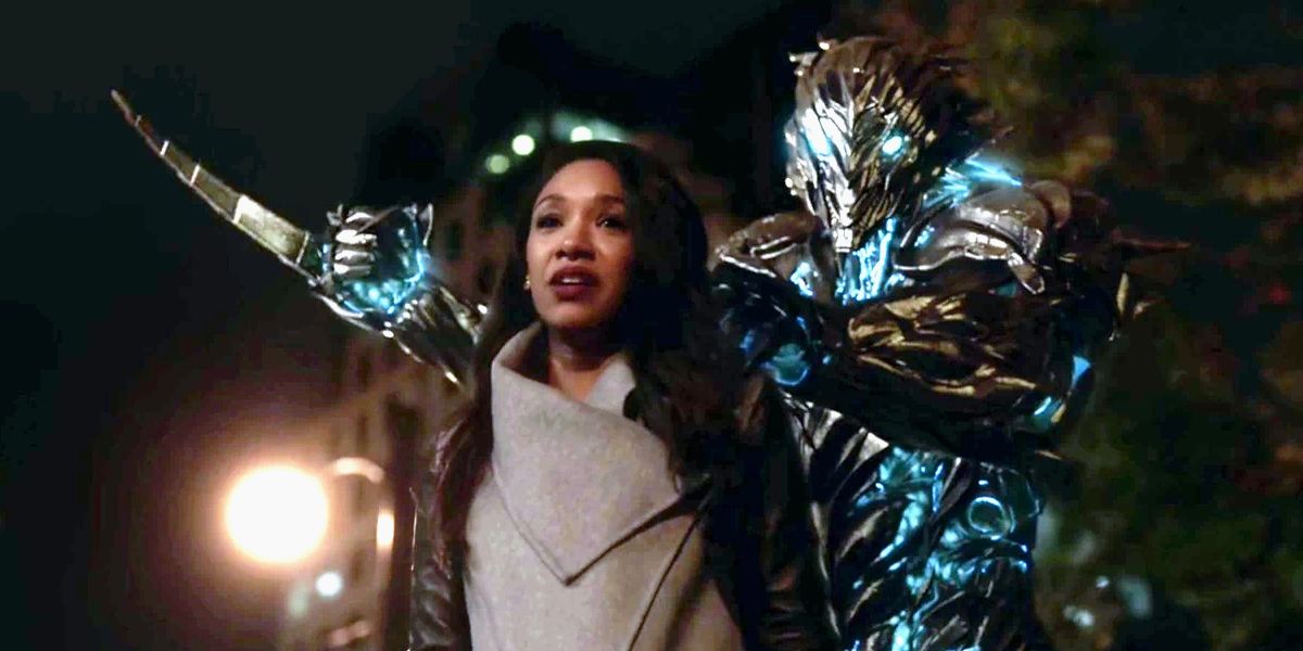 Savitar holding Iris in front of him as he prepares to stab her in The Flash