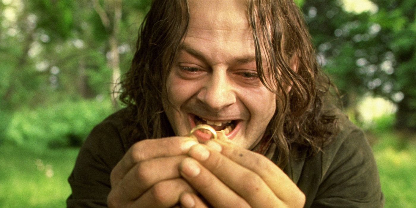 Smeagol holds the ring and stares at it longingly in The Lord of the Rings