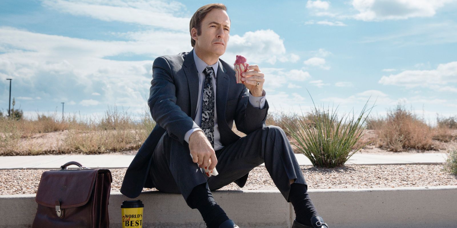 Bob Odenkirk sitting on the curb in Better Call Saul